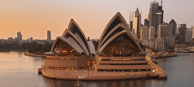 Sydney Opera House and harbour skyline at sunset